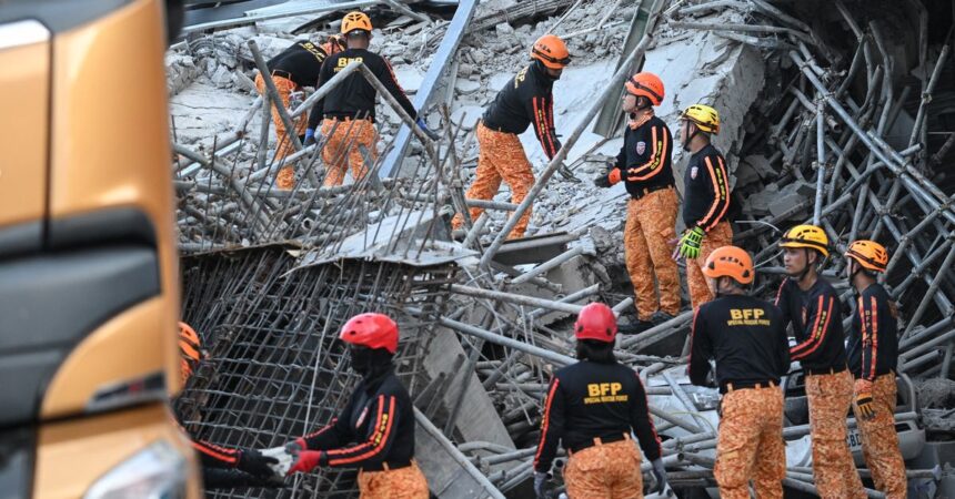 Buscan a 20 desaparecidos tras derrumbe de edificio en Filipinas